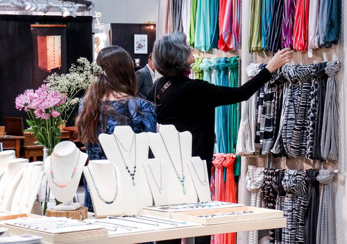 Shoppers looking at handmade merchandise