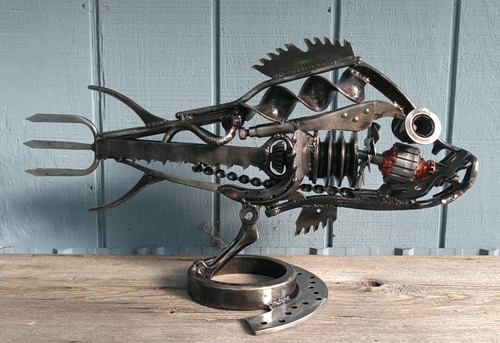 Reclaimed metal sculpture of a flounder by Christian Schoenig