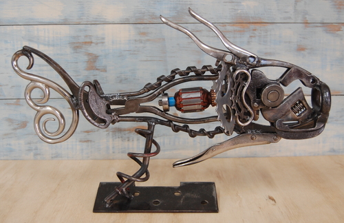 Reclaimed metal sculpture of a fish by Christian Schoenig