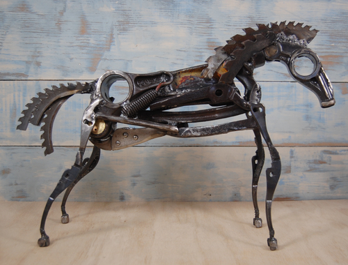 Reclaimed metal sculpture of a horse by Christian Schoenig