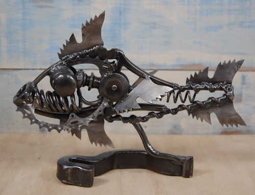 Reclaimed metal sculpture of a pirahna by Christian Schoenig