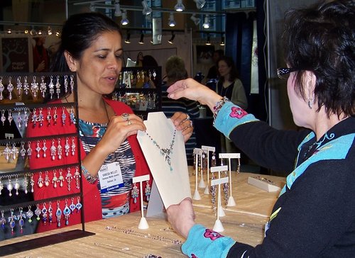shopper looking at handmade jewelry