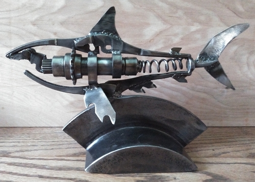 Reclaimed metal sculpture of a shark by Christian Schoenig