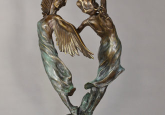 Bronze sculpture of a woman and an angel dancing by Janet MacKay