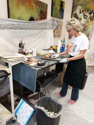 Artist Bela Fidel in her studio