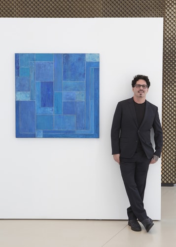 Artist Stephen Cimini with one of his compositions