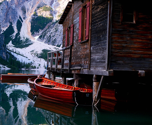 A boat in the water tethered to the dock