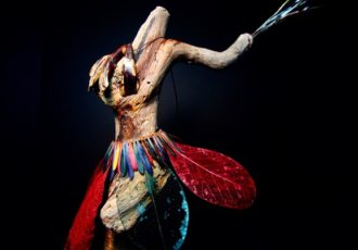 Abstract found object sculpture of a fire dancer by Maura Freeman