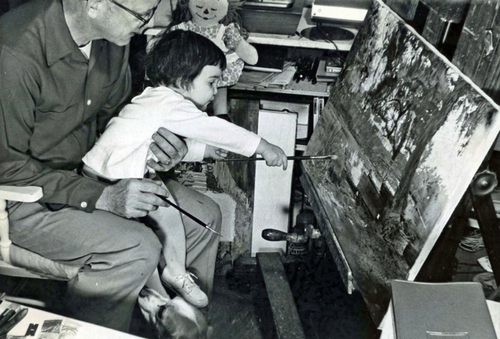 An artist and his daughter in the studio