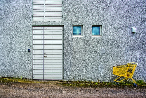 Photograph of a door and shopping cart in Reykjavik, Iceland by Jenny Nordstrom