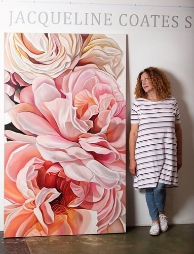 Artist Jacqueline Coates with her painting "Calvacade of Cream Roses"