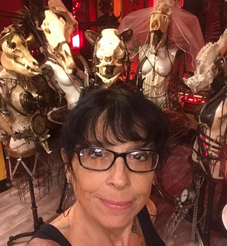 Artist Sue Moerder with her skull assemblages