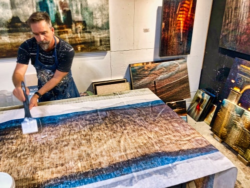 Artist Sol Hill working in his studio
