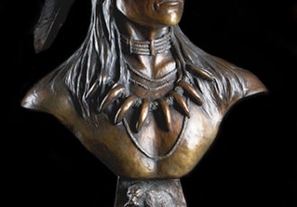 bronze bust of a native American bear hunter by Rick hill