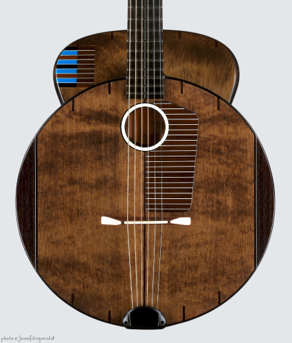 wooden round body acoustic guitar by Thierry André