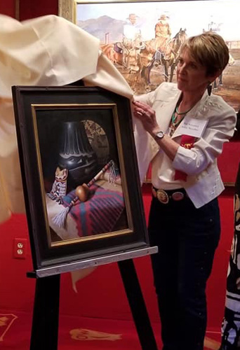 Artist Sue Krzyston with her work