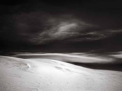 black and white photograph of a cloud formation over dunes at White Sands, NM, by Nathan McCreery