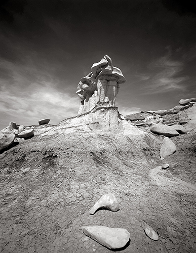black and white photograph of Three Face Tower in the Bisti Badlands, NM, by Nathan McCreery