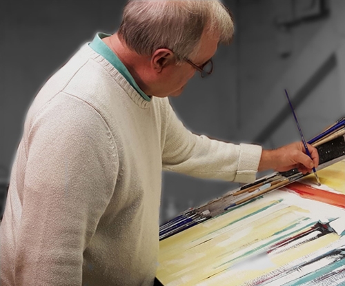 Artist John Chehak working in his studio