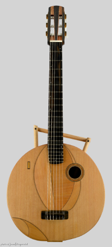 wood round body acoustic guitar by Thierry André