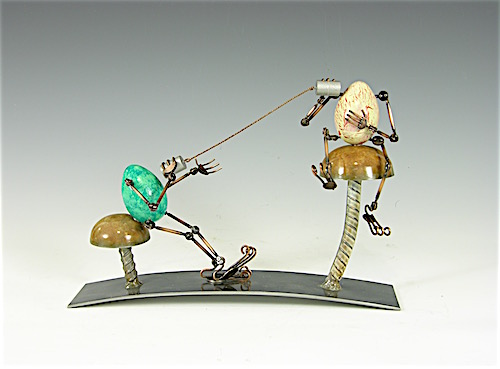 mixed media sculpture of two eggs playing telephone with cans by Tomoaki Orikasa