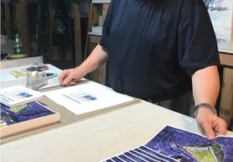 Artist signing prints