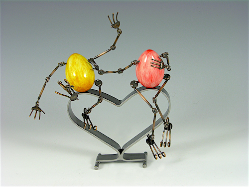 mixed media sculpture of two eggs on a heart by Tomoaki Orikasa