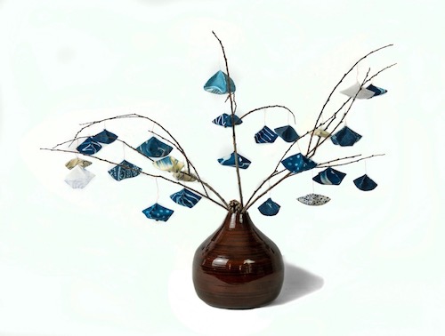 3-D fiber art of a tree branch in a vase by Mirka Knaster