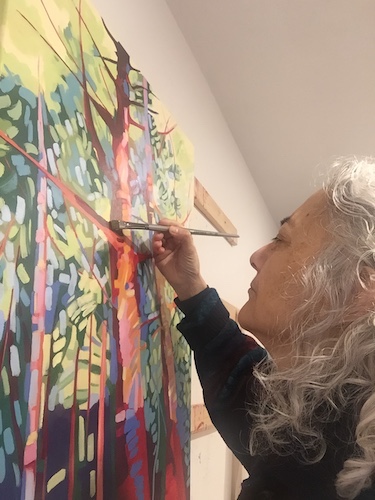 Artist Marcia Wise working in her studio