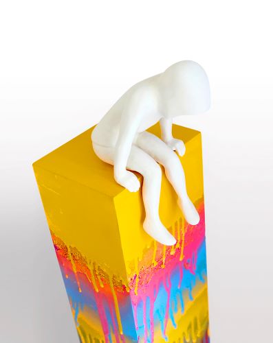 porcelain sculpture of a white figure on a colorful base by Rob Lenihan