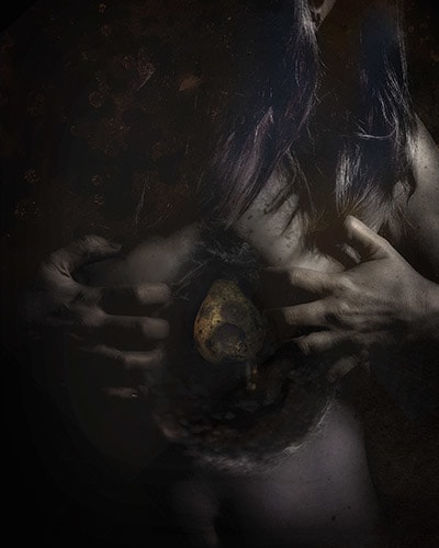 surrealistic photo art of rotting fruit inside a woman by Jennifer Gleason