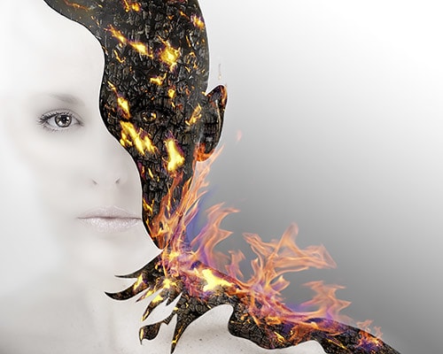 surrealistic photo art of a woman on fire by Jennifer Gleason