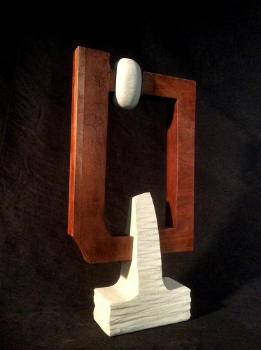 abstract wood and stone sculpture by William Kolok
