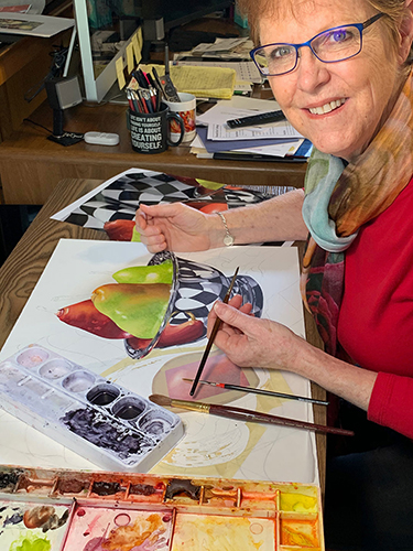 Artist Debbie Bakker at work in her studio