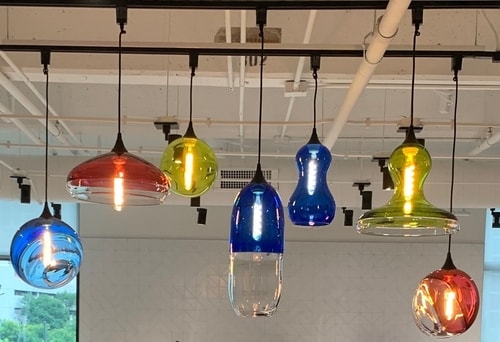 series of blown glass pendant lights for the Arts & Science Council in Charlotte, NC by Jake Pfeifer