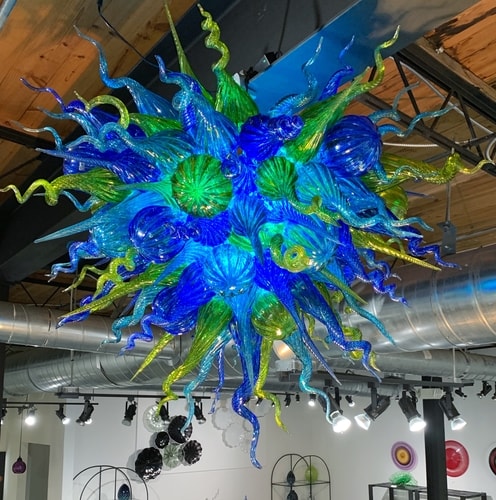 large blue/green blown glass chandelier by Jake Pfeifer
