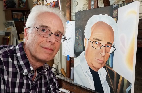 Artist Dave Martsolf in his studio with his self-portrait