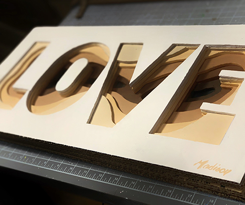 the word Love in sculpted cardboard by Sherri Madison