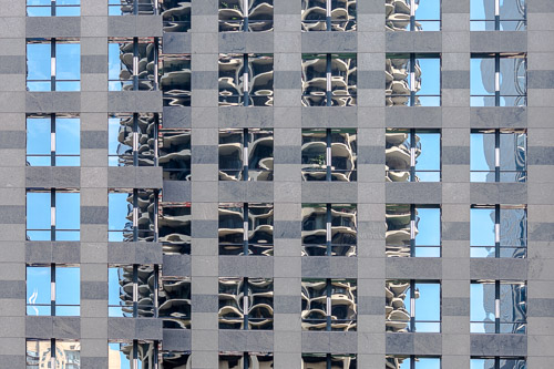 photograph of a Chicago building reflected in anothe building by Lauri Novak
