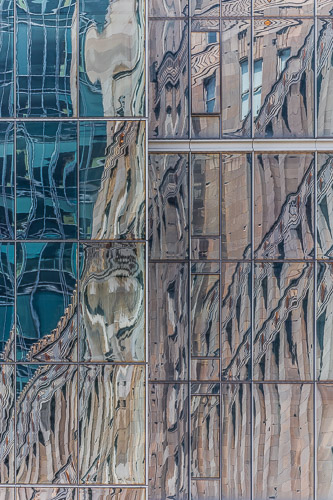 photograph of a Chicago building reflected in another building by Lauri Novak