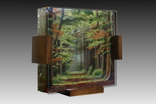 Painted layered glass sculpture of a forest scene by Michael Frank Peterson