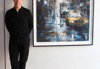 Watercolor painter Tim Saternow with his artwork