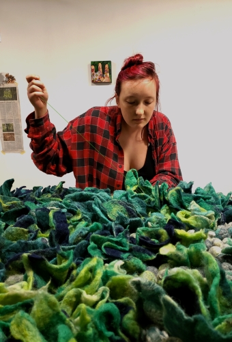 Artist Mallory Zondag working on her fiber art