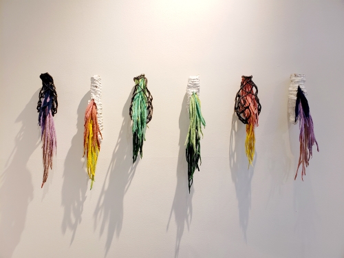 mixed media fiber art of cocoons by Mallory Zondag