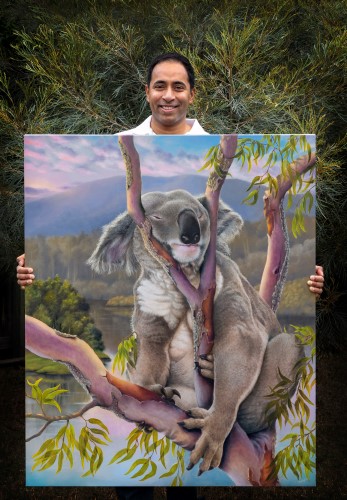 artist Swapnil Nevgi with his painting of a Koala titled "Sleeping Beauty"