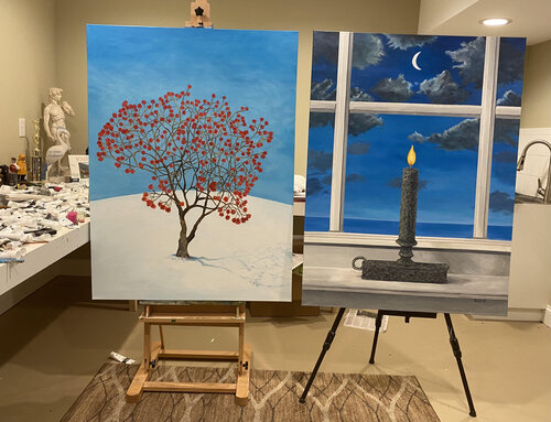 Two acrylic paintings on easels in an artist studio