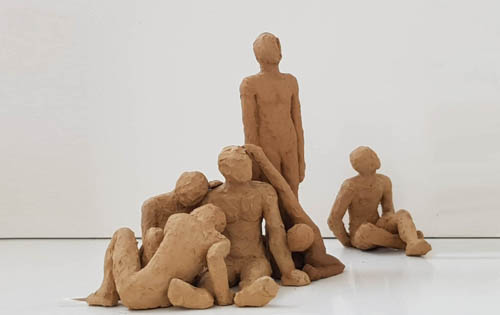 Group of figures arranged in a puzzle by Paulina Cassimatis