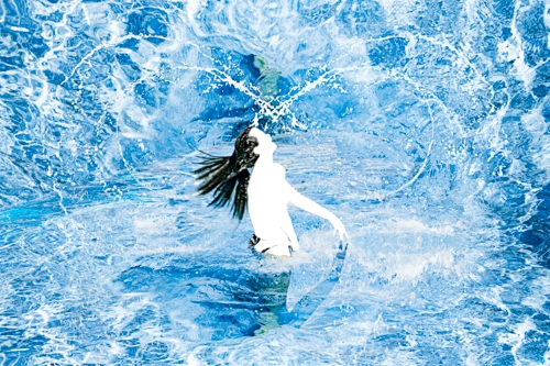 photography of a woman in a pool by Helene Hubert
