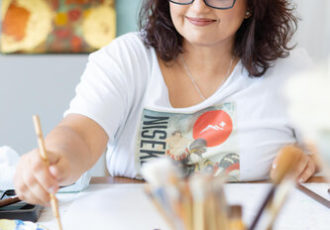 Artist Rajul Shah working in her studio