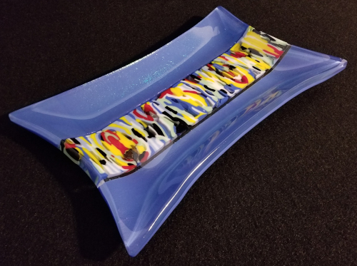 blue, yellow, red and black fused glass plate by Robbie MacIver